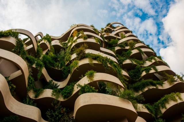 Luxury eco-friendly home in Spain with sustainable architecture, bioconstruction materials, and natural surroundings.