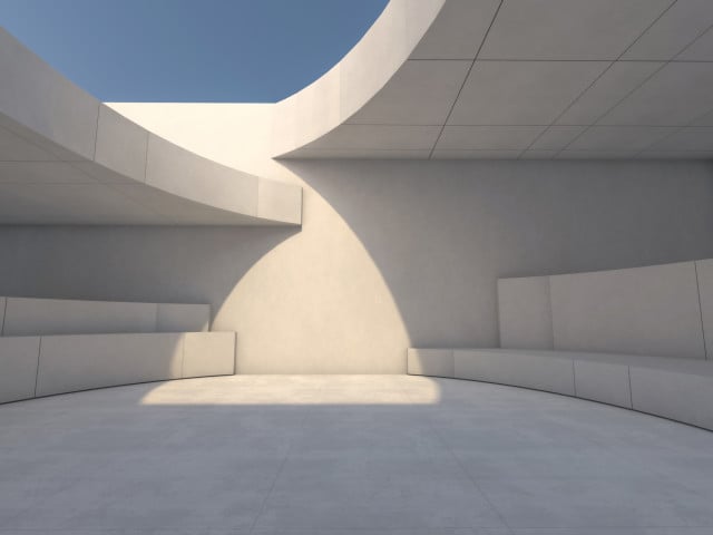 Modern internal courtyard with concrete steps where you can see the sky and the passage of light to the interior of the property.
