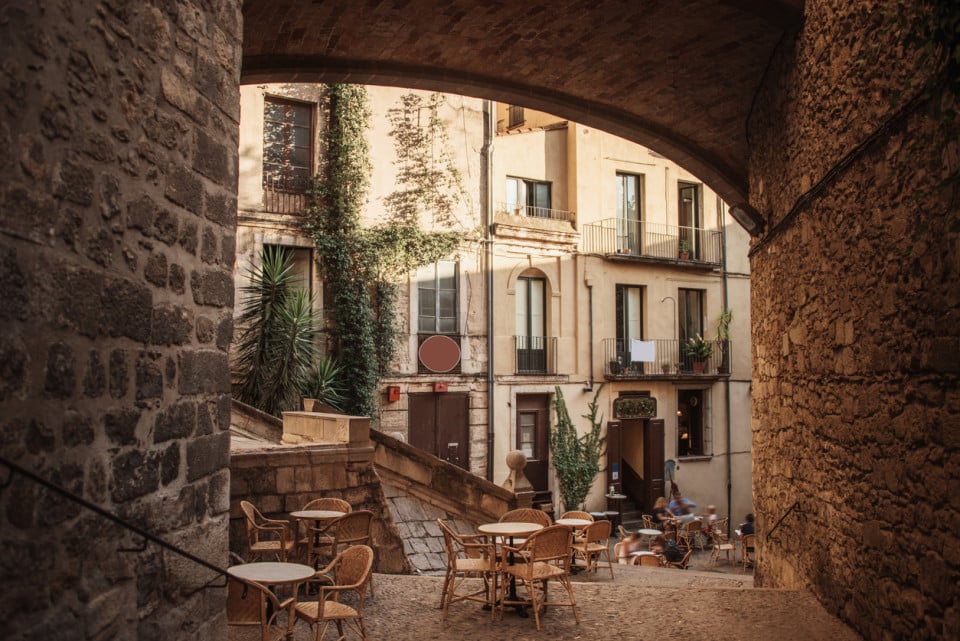 Stone buildings, tables, chairs, town