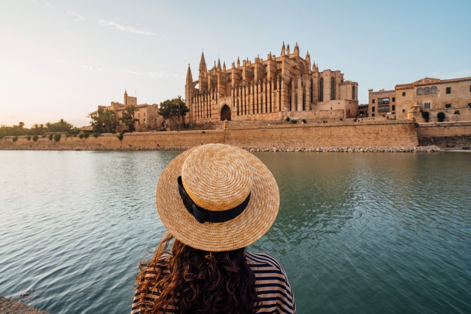Woman gazing at the Mallorca Cathedral with sea views