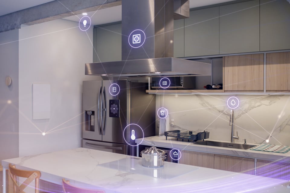 Modern tech kitchen featuring smart appliances connected to a central control system for efficient and automated home management.