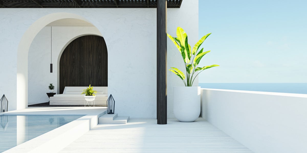 Mediterranean style luxury home overlooking the sea with bright natural light and elegant architectural details