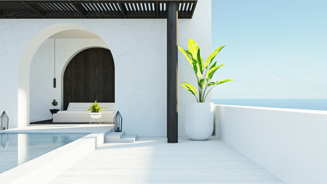 Mediterranean style luxury home overlooking the sea with bright natural light and elegant architectural details