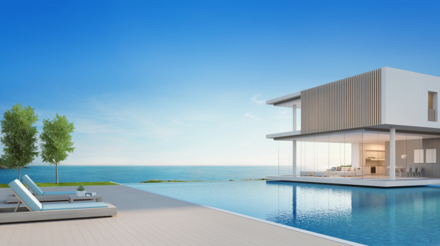 Luxury modern house with panoramic sea views, featuring a spacious pool and sleek architectural design.