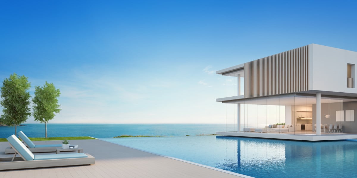 Luxury modern house with panoramic sea views, featuring a spacious pool and sleek architectural design.