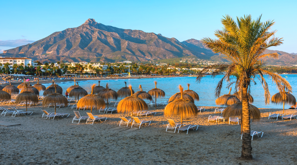 Beautiful view from the beach of Marbella where you can see the mountains on the horizon.