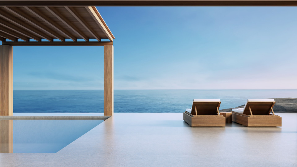 Two chairs on a luxurious, minimalist seafront property in Ibiza with an ocean view