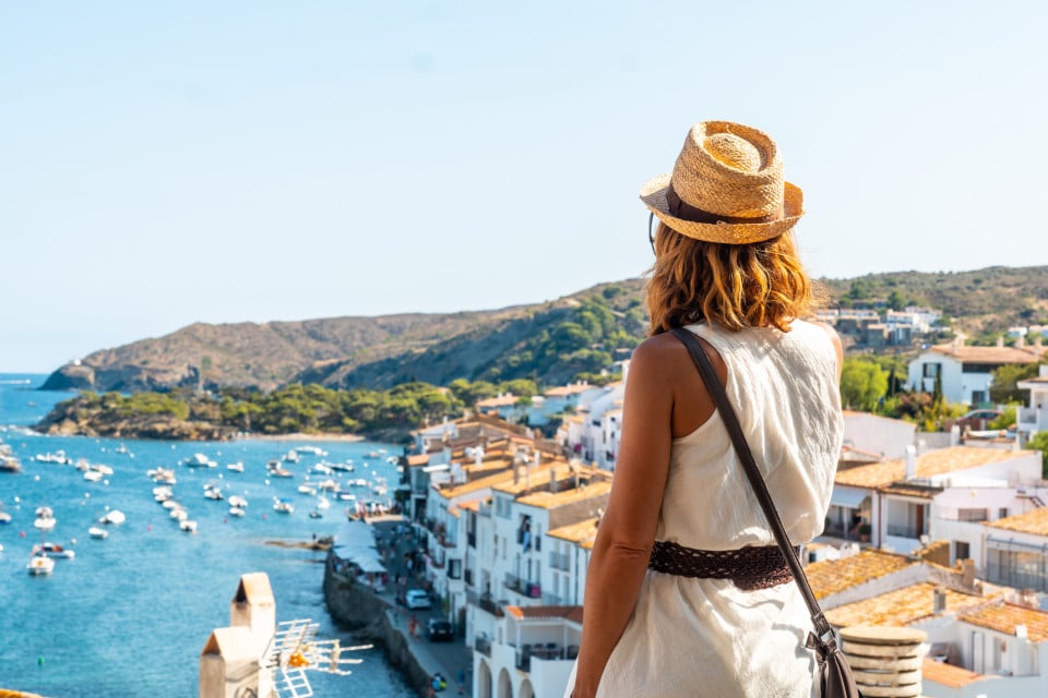 Woman contemplating the Mediterranean Sea from a hill. Image from Lucas Fox's blog