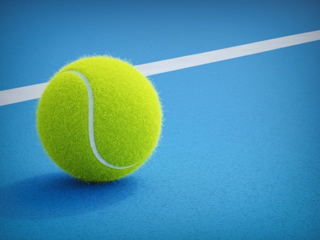 Paddle ball resting on blue court