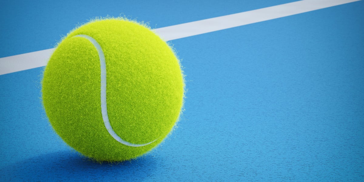 Paddle ball resting on blue court