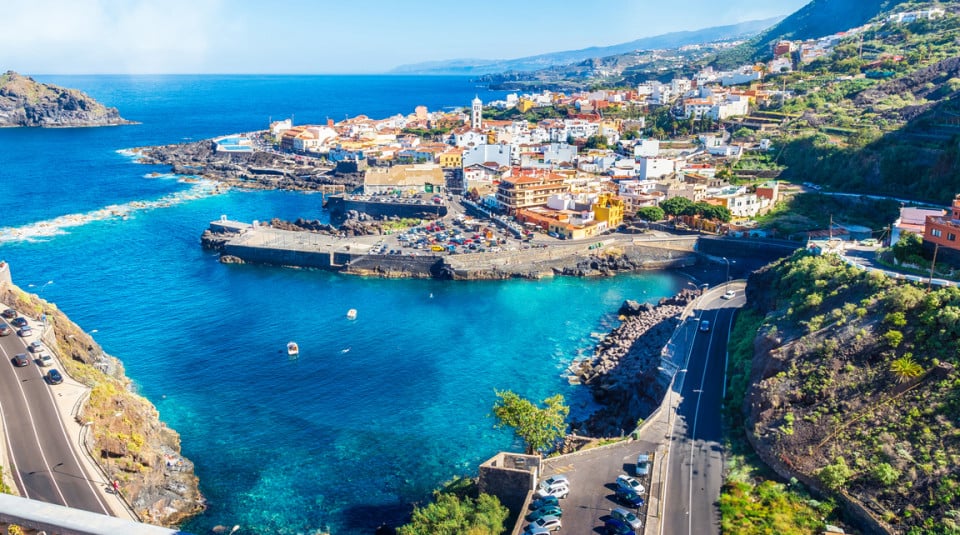 Aerial view of the Spanish coast where you can see the city, the roads and the beautiful Mediterranean Sea.