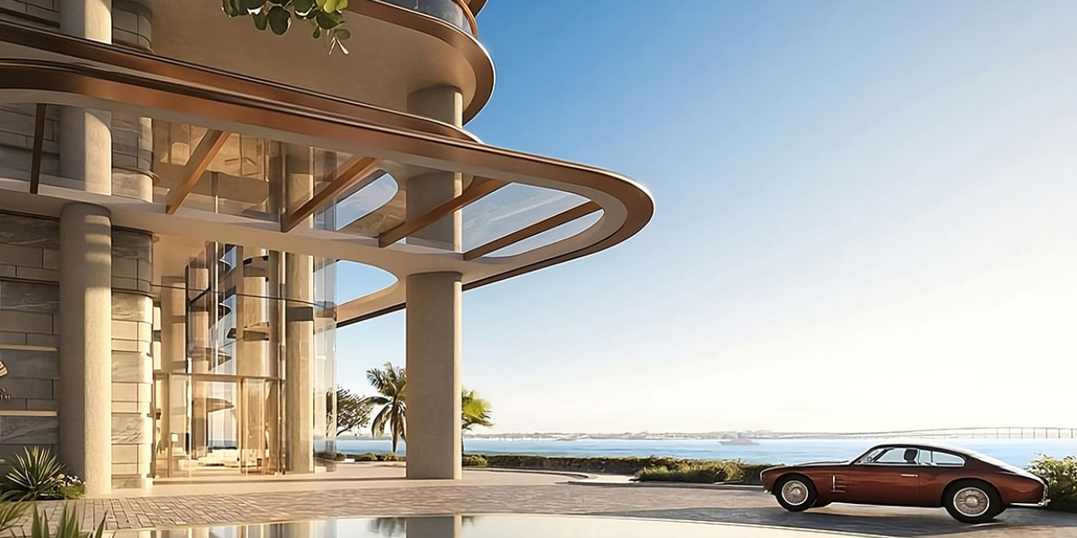 Beautiful photo of the new brand new housing complex showing an antique car parked in the lobby of the tower overlooking the sea.