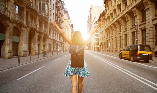 Tourist enjoying the beautiful streets of Spain at sunset.