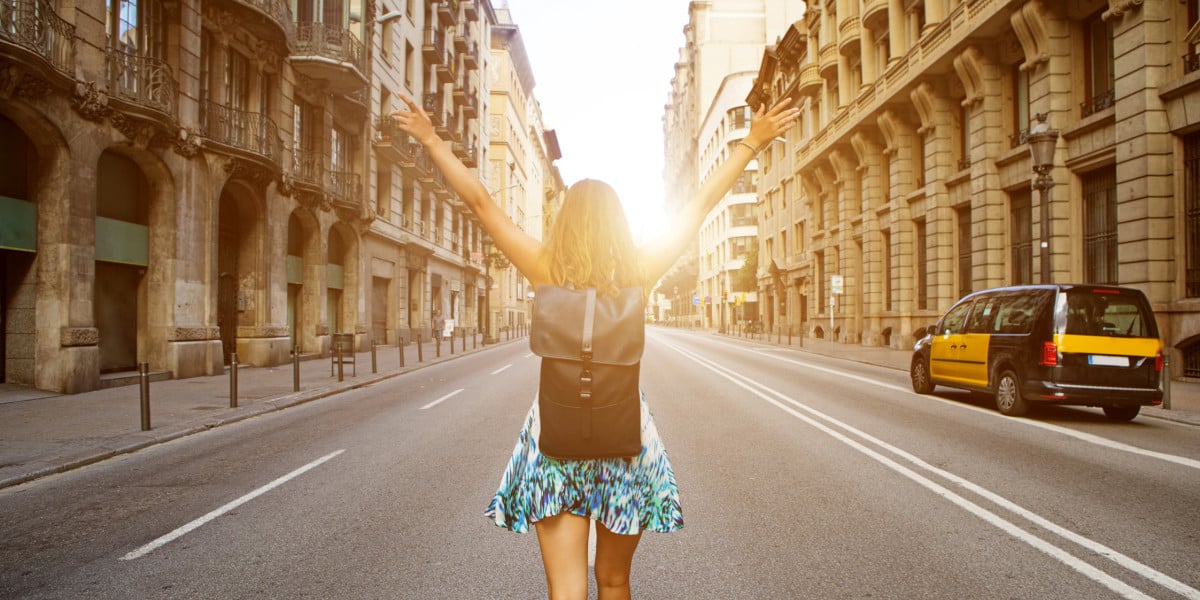 Tourist enjoying the beautiful streets of Spain at sunset.