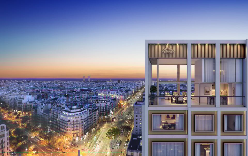 Beautiful aerial view of the new Mandarin Oriental building located in Madrid where you can see the penthouse and the gradient from orange to blue horizon.